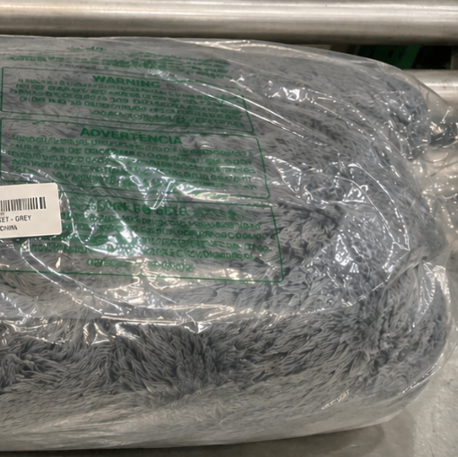 Plastic-wrapped product with a label on a metal surface